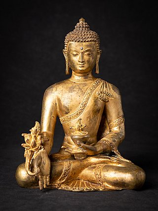 Nepalesische Medizin-Buddha-Statue aus Bronze, frontal sitzend mit Schale und Pflanze in der Hand