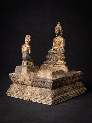 Thai bronze Buddha statue with kneeling monk, three-quarter view