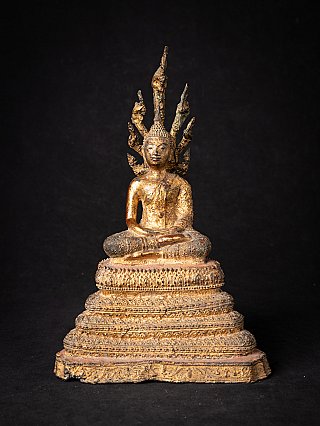 Buddha statue from Thailand on Naga, seated in dhyana mudra, full front view