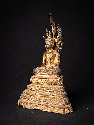 Antique Thai Buddha on Naga snake