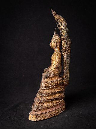 Antique Thai Buddha on Naga snake