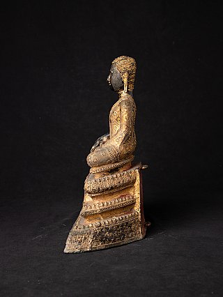 Thai bronze monk statue seated, left side profile with head silhouette and stepped base