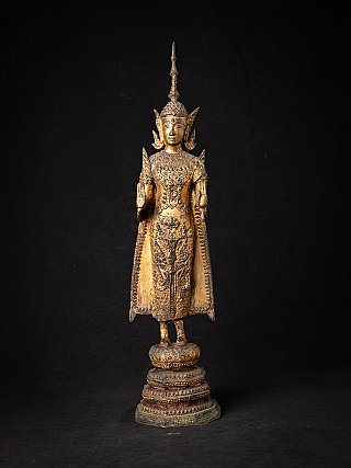 Thai bronze Buddha statue standing in Abhaya mudra, full front view on tiered base