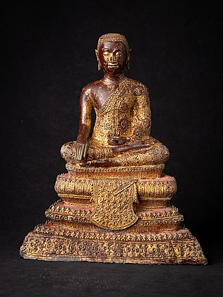 Thai bronze monk statue seated in bhumisparsha mudra, full-front on tiered base