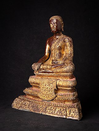 Bronze monk statue from Thailand in three-quarter view, showing the ornate tiered base