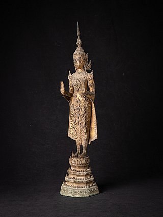 Bronze Buddha statue from Thailand, standing three-quarter view showing Abhaya mudra