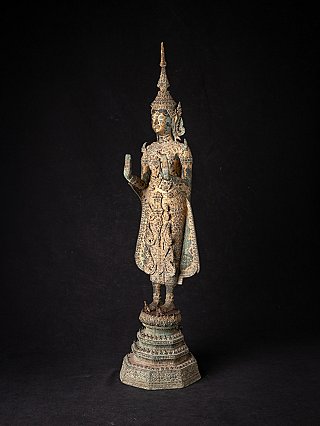 Bronze Buddha statue from Thailand in three-quarter view, raised hand in Abhaya mudra
