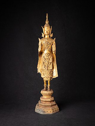 Thai bronze Buddha statue in standing posture, full front view with Abhaya mudra