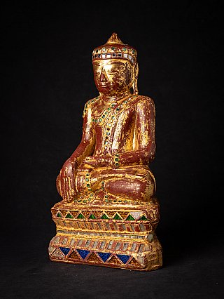 Burmese wooden Buddha statue with inlaid decoration, three-quarter left view