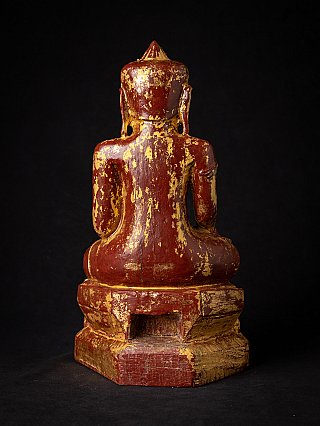 Burmese wooden Buddha statue seated, rear view showing worn gilded surface