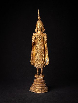 Thai Buddha statue in Abhaya mudra, full-front view on tiered base