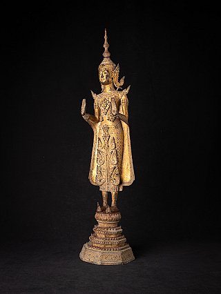 Bronze Thai Buddha statue with Abhaya mudra and tall crown, three-quarter view