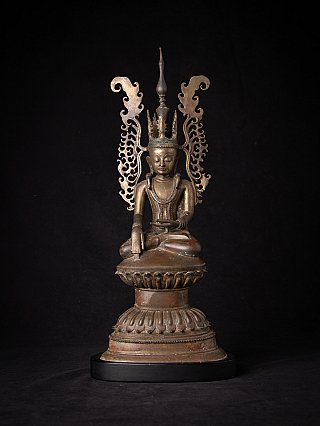 Crowned Buddha statue in bronze from Burma, seated on lotus base with openwork aureole, front view