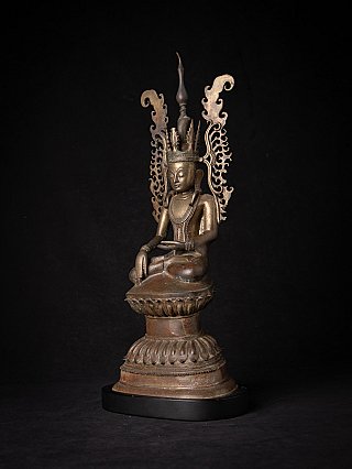 Bronze crowned Buddha statue from Myanmar with flame-like aureole, three-quarter view