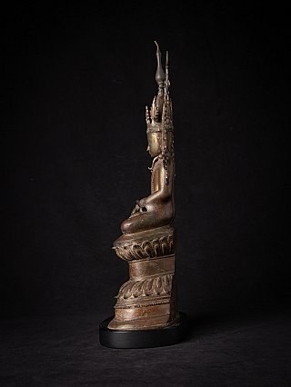 Crowned Buddha statue in bronze from Burma, seated in bhumisparsha mudra, side profile