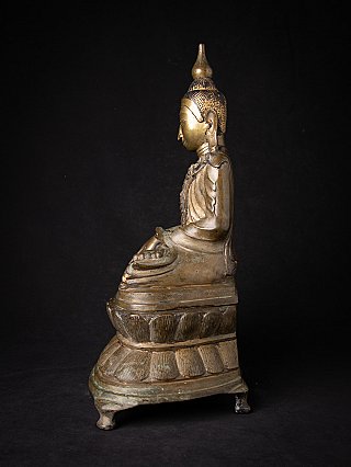 Shan Buddha statue in bronze from Burma, seated side profile with tall topknot