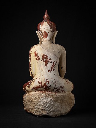 Burmese marble Buddha statue, rear view showing flaking red paint on the back and head