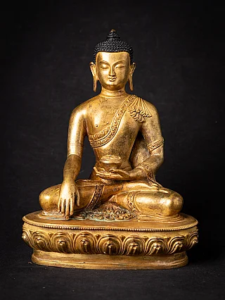 Nepali bronze Buddha statue seated on lotus base, full front view with bhumisparsha mudra
