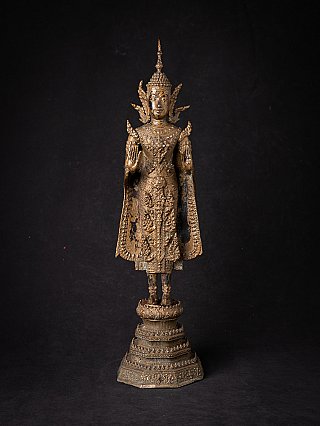 Thai bronze Buddha statue on tiered base, full front view with Abhaya mudra