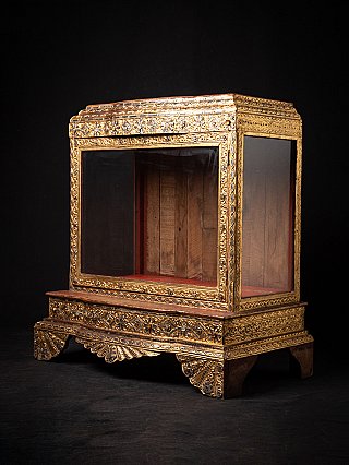 Antique Mandalay-period Burmese wooden temple shrine, three-quarter view with glass panels