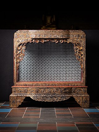 Antique Burmese wooden temple shrine with gilded front opening and mirrored back panel