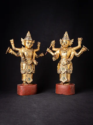 Burmese Nat statue pair in wood, standing and gilded, full front view on red bases