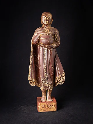 Burmese wooden monk statue, standing with alms bowl on base, full front view