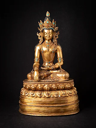 Old bronze Nepali crowned Buddha statue
