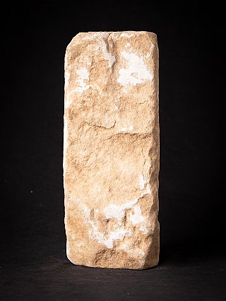 Rear view of the antique Indian marble temple statue, flat rough-carved back