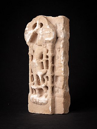 Marble Jain temple statue fragment with standing figure, three-quarter view showing side edge