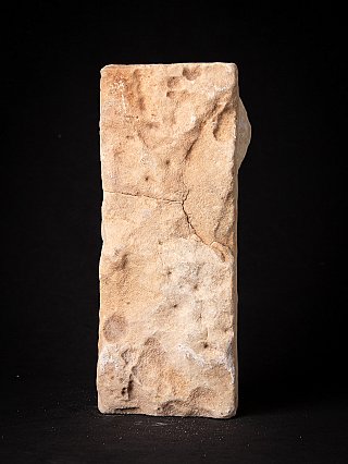 Rear view of the antique marble Jain temple fragment, showing a crack across the surface