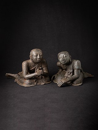 Pair of Burmese bronze monk statues seated, angled front view with namaskara mudra