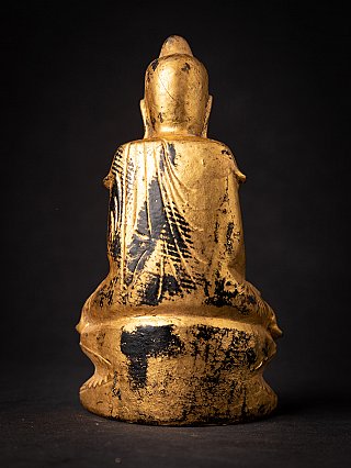 Rückansicht der hölzernen Shan-Buddha-Statue aus Myanmar mit Abrieb der Vergoldung