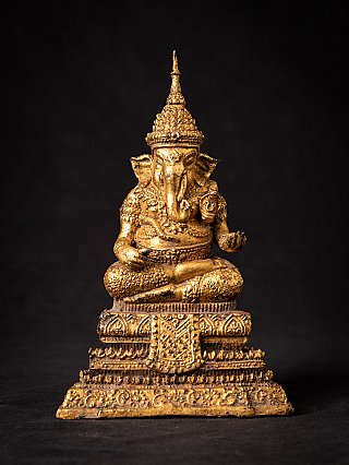 Thai bronze Ganesha statue seated on ornate tiered base, full front view