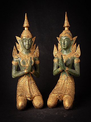 Set of Thai bronze temple guard statues kneeling with hands in namaskara mudra, front view