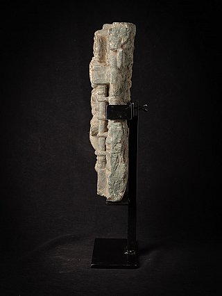 Side profile of the Indian relief panel on stand, showing thickness and rough edge