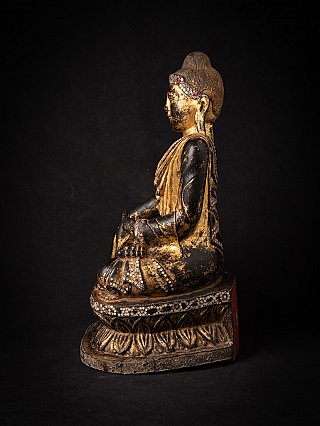 Mandalay period wooden Buddha statue from Myanmar, side profile on lotus base