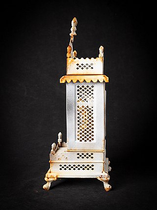 Side view of the Nepalese metal shrine with pierced lattice panel