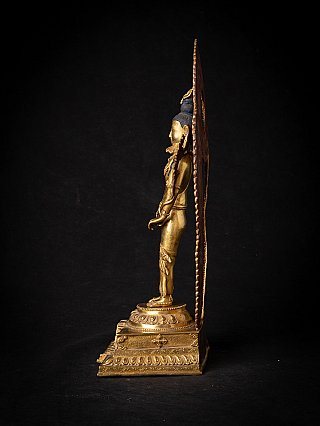 Lokeshwor statue in bronze from Nepal, left side profile with tall aureole