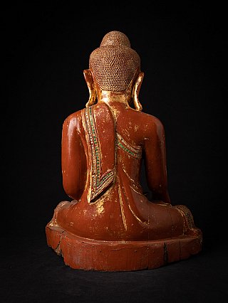 Antique Burmese wooden Buddha statue, rear view showing robe drape down the back