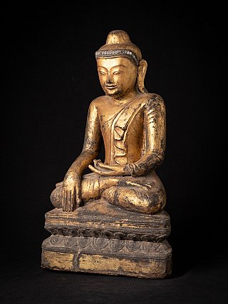 Burmese wooden Buddha statue with gilded surface, three-quarter right view