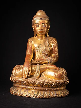 Burmese Mandalay Buddha statue in wood, seated in bhumisparsha mudra, full-front view