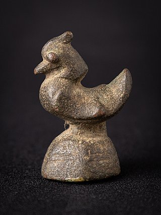 Antique Burmese bronze opium weight, animal-shaped form in side view on a domed base