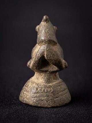 Burmese bronze opium weight, rear view showing the open looped tail and rounded base