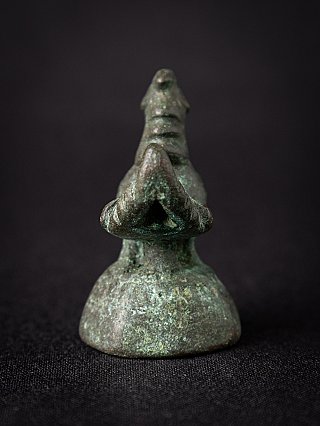 Burmese bronze opium weight, front view showing the pointed chest and rounded base