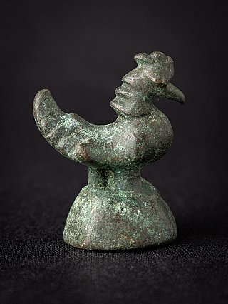 Bronze opium weight from Burma (Myanmar), bird profile with raised tail and green patina