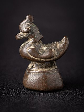 Antique bronze opium weight from Burma (Myanmar), animal form on base in three-quarter view