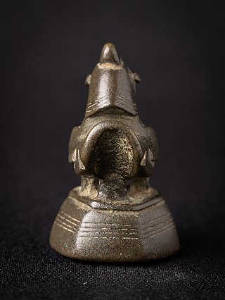 Burmese bronze opium weight with animal figure on stepped base, rear view