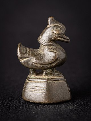 Burmese bronze opium weight with bird-shaped figure on base, right side view