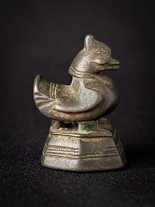 Antique Burmese bronze opium weight, opposite side view with tail feather lines